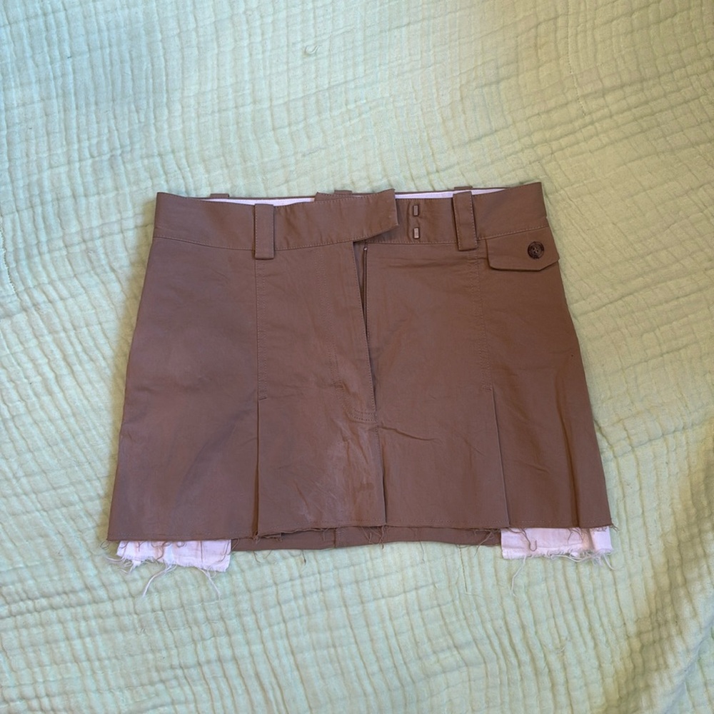 Tan mini skirt with distressed pockets
